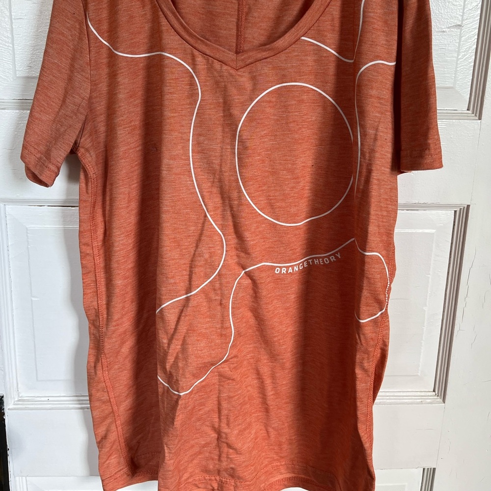 Orangetheory fitness orange splat point shirt.